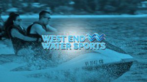 A man is riding a surfboard in the water.