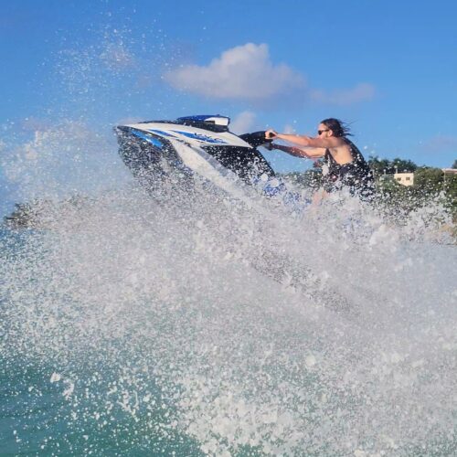 A person on a jet ski in the ocean.