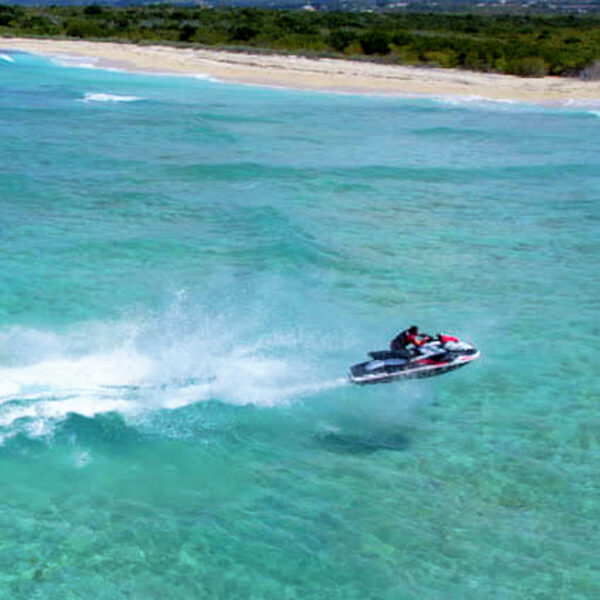 A person on a jet ski in the ocean.