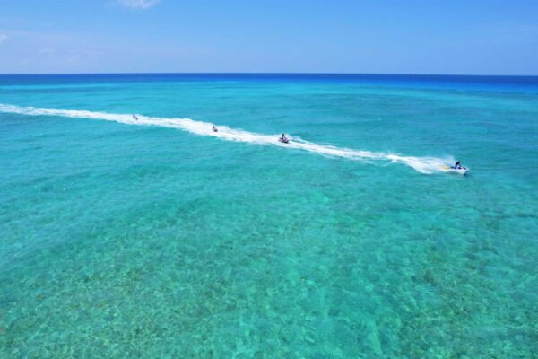 A body of water with people riding on it