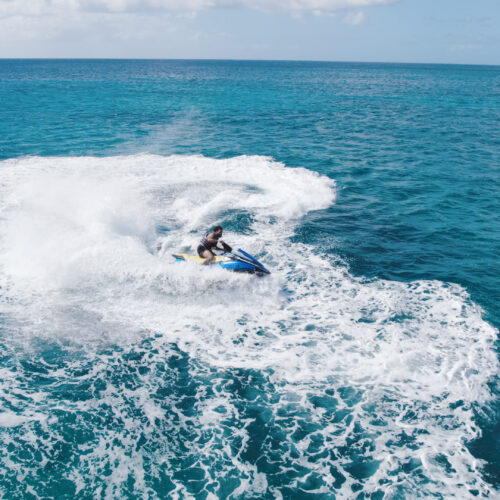 A person on a surfboard in the ocean.