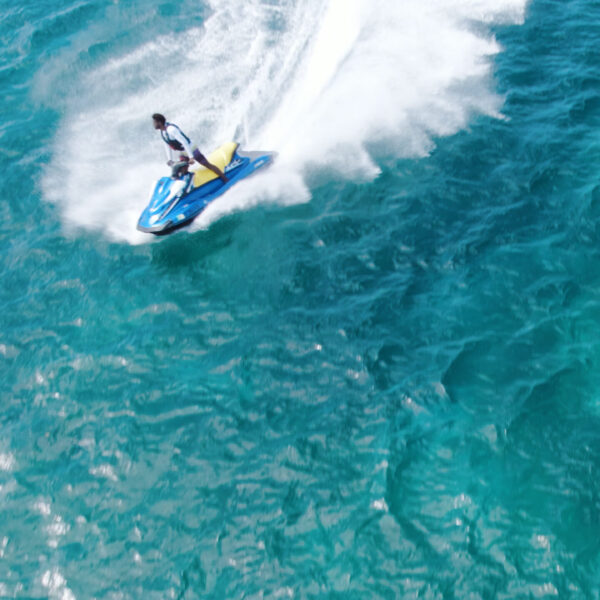 A person on water skis in the ocean.