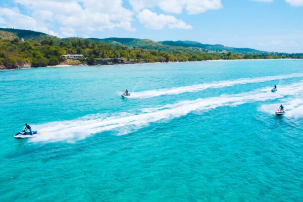 A person is water skiing in the ocean.